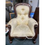 A VICTORIAN STYLE SPOON BACK LOUNGE DOLL'S CHAIR WITH A BUTTON BACK ON FRONT CABRIOLE LEGS