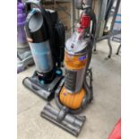 A DYSON DC24 VACUUM AND A VAX VACUUM