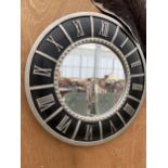 A DECORATIVE WALL CLOCK MIRROR