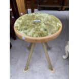 A NESS STOOL WITH GREEN UPHOLSTERY, ON FOUR METAL SPLAYED LEGS, 13" DIAMETER