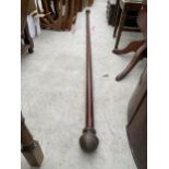 A VICTORIAN CURTAIN POLE, 98" LONG WITH BRASS TERMINALS AND SIXTEEN RINGS