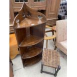 AN EDWARDIAN FOUR TIER CORNER DISPLAY SHELF AND A SMALL STOOL