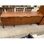 A RETRO TEAK A H McINTOSH & CO LTD SIDEBOARD ENCLOSING THREE DRAWERS AND THREE CUPBOARDS, 79" WIDE