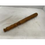 A VINTAGE MILITARY POLICE WOODEN TRUNCHEON