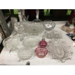A COLLCETION OF GLASSWARE TO INCLUDE DECANTERS, DISHES, CAKE PLATE AND A CRANBERRY BOTTLE AND DISH