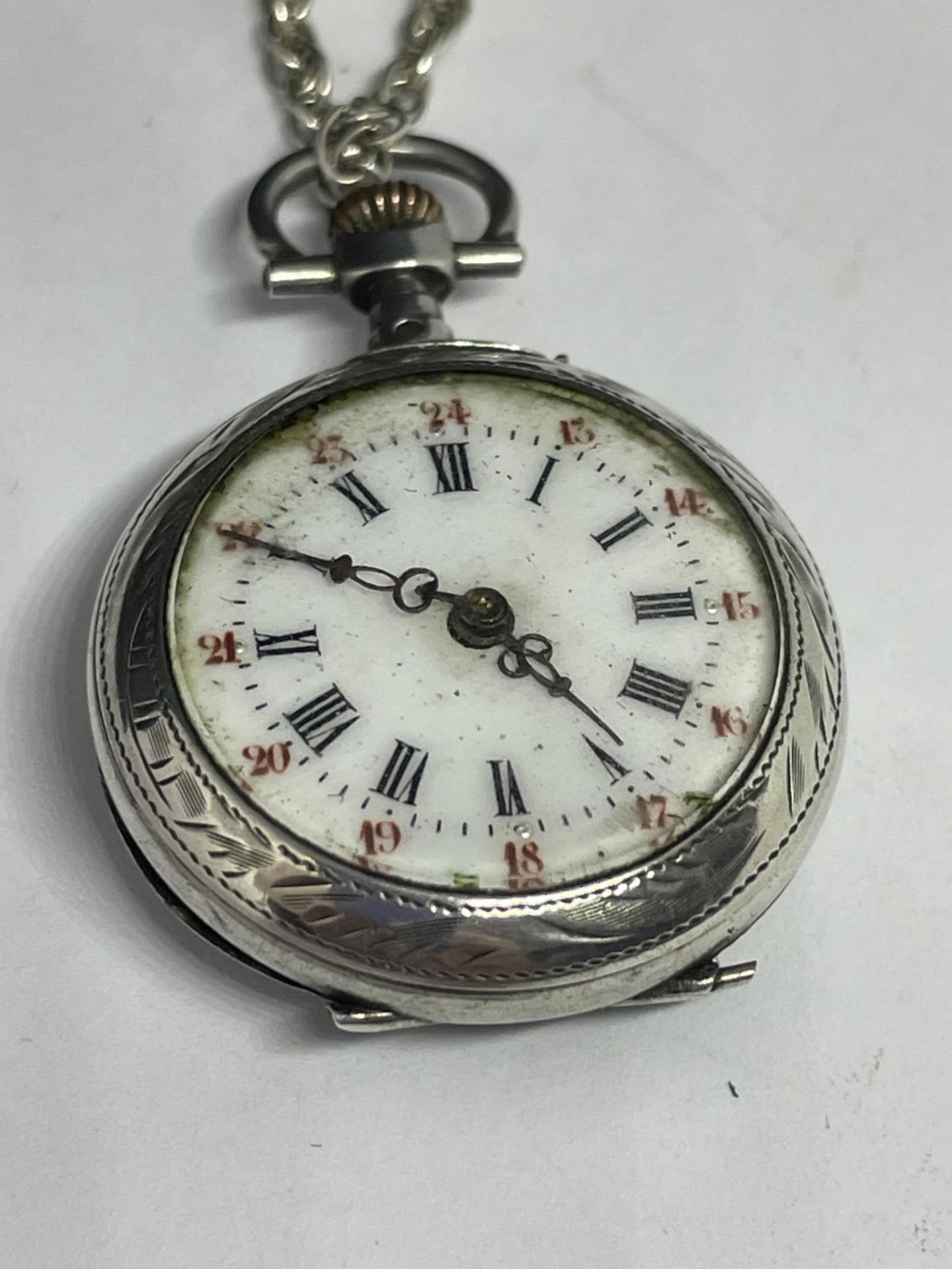 A DECORATIVE FOB WATCH ON A MARKED SILVER CHAIN - Image 2 of 3