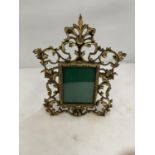 A BRASS PHOTO FRAME IN A ROCOCO STYLE HEIGHT 30CM