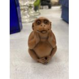 A WOODEN CARVED NETSUKE MONKEY