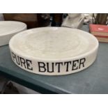 A LARGE 'PURE BUTTER' STONEWARE SHOP DISPLAY PLATE MARKED 'WEIGHWELL SERVICE', BERRY AND