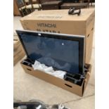 A 42 INCH HITACHI WIDE SCREEN TV COMPLETE WITH BOX