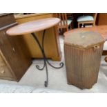 A HARDWOOD OCCASIONAL TABLE ON BLACK METALWARE BASE, 23" DIAMETER AND A LLOYD LOOM HEXAGONAL LINEN