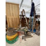A LARGE ASSORTMENT OF GARDEN TOOLS TO INCLUDE SHOVELS, PICK AXE, WOODEN STEP LADDER AND RIDDLES ETC