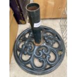 A DECORATIVE CAST IRON PARASOL BASE