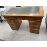 A YEW WOOD TWIN-PEDESTAL DESK WITH INSET LEATHER TOP ENCLOSING EIGHT DRAWERS, 48X24"