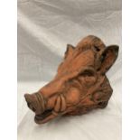 A TERRACOTTA WALL MOUNTED BUST OF A WILD BOAR LENGTH 31 CM HEIGHT 30 CM