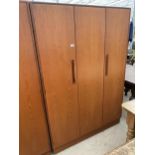 A RETRO TEAK G-PLAN THREE DOOR WARDROBE, TWO BEING BI-FOLD, 48" WIDE