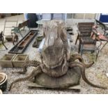 A LARGE CHAIN SAW CARVING OF AN OCTOPUS