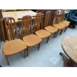 A SET OF SIX RETRO TEAK DINING CHAIRS AND AN ERCOL STYLE DINING CHAIR