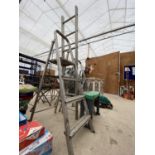 A THREE RUNG ALUMINIUM STEP LADDER, A TWO RUNG ALUMINIUM STEP LADDER A SEVEN RUNG LADDER AND A A