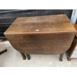 A MID 20TH CENTURY OAK DROP-LEAF DINING TABLE