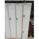 A METAL LOCKER CABINET WITH KEY