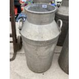 A VINTAGE MILK CHURN