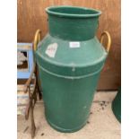 A VINTAGE GREEN PAINTED CAST IRON MILK CHURN (A/F TO BASE)