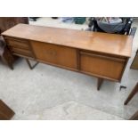 A RETRO TEAK SIDEBOARD ENCLOSING THREE DRAWERS, TWO CUPBOARDS AND DROP-DOWN COCKTAIL SECTION, 71.