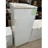 A WHITE UPRIGHT FRIDGE