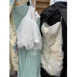 A WEDDING DRESS, A GREEN BRIDESMAIDS DRESS AND A FLOWER GIRL DRESS
