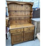 A MODERN PINE DRESSER COMPLETE WITH PLATE RACK, 43" WIDE