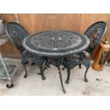 A VINTAGE CAST ALLOY BISTRO SET COMPRISING OF A ROUND TABLE AND TWO CHAIRS