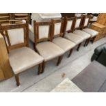 A SET OF SIX LATE VICTORIAN SATINWOOD DINING CHAIRS WITH CARVED TOP RAIL AND TURNED FRONT LEGS