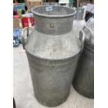 A VINTAGE MILK CHURN