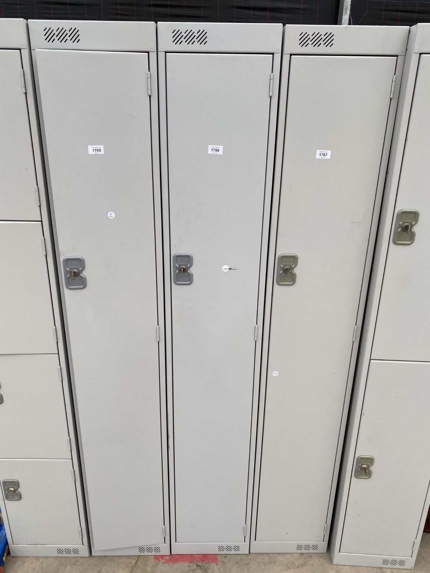 A METAL LOCKER CABINET WITH KEY