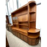 A RETRO TEAK NATHAN UNIT ENCLOSING CUPBOARDS AND DRAWERS, COMPLETE WITH MATCHING CORNER UNIT, 60 AND