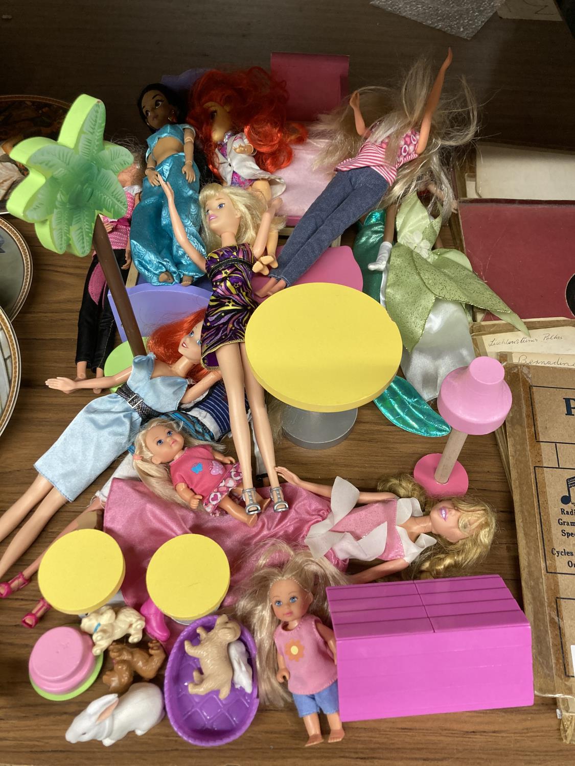 A QUANTITY OF DOLLS AND ACCESORIES TO INCLUDE DISNEY