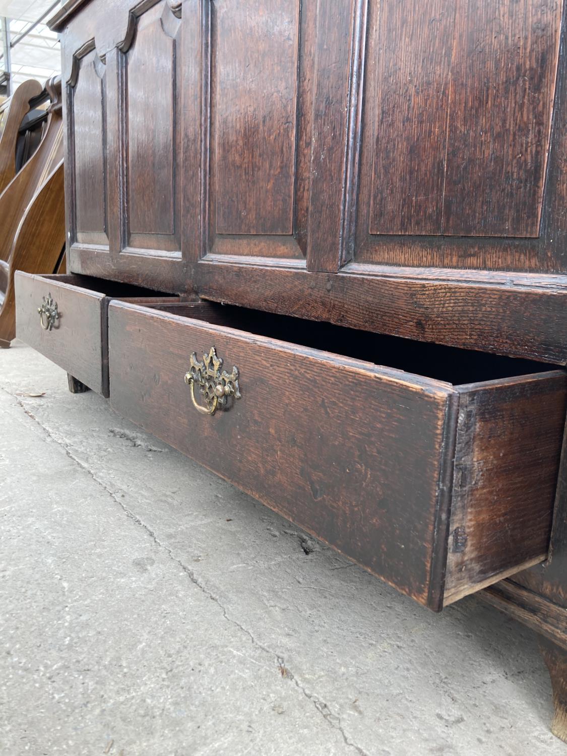 A GEORGE III OAK BLANKET CHEST WITH TWO DRAWERS TO THE BASE AND FOUR PANEL FRONT, 55" WIDE - Image 4 of 9