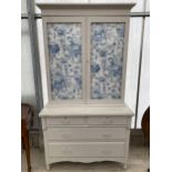 A 19TH CENTURY TWO DOOR PAINTED BOOKCASE ON BASE ENCLOSING TWO SHORT AND TWO LONG DRAWERS, WITH
