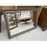 A MODERN GILT FRAMED WALL MIRROR, 38X27"