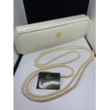 A LONG STRAND OF LOTUS PEARLS IN A PRESENTATION BOX