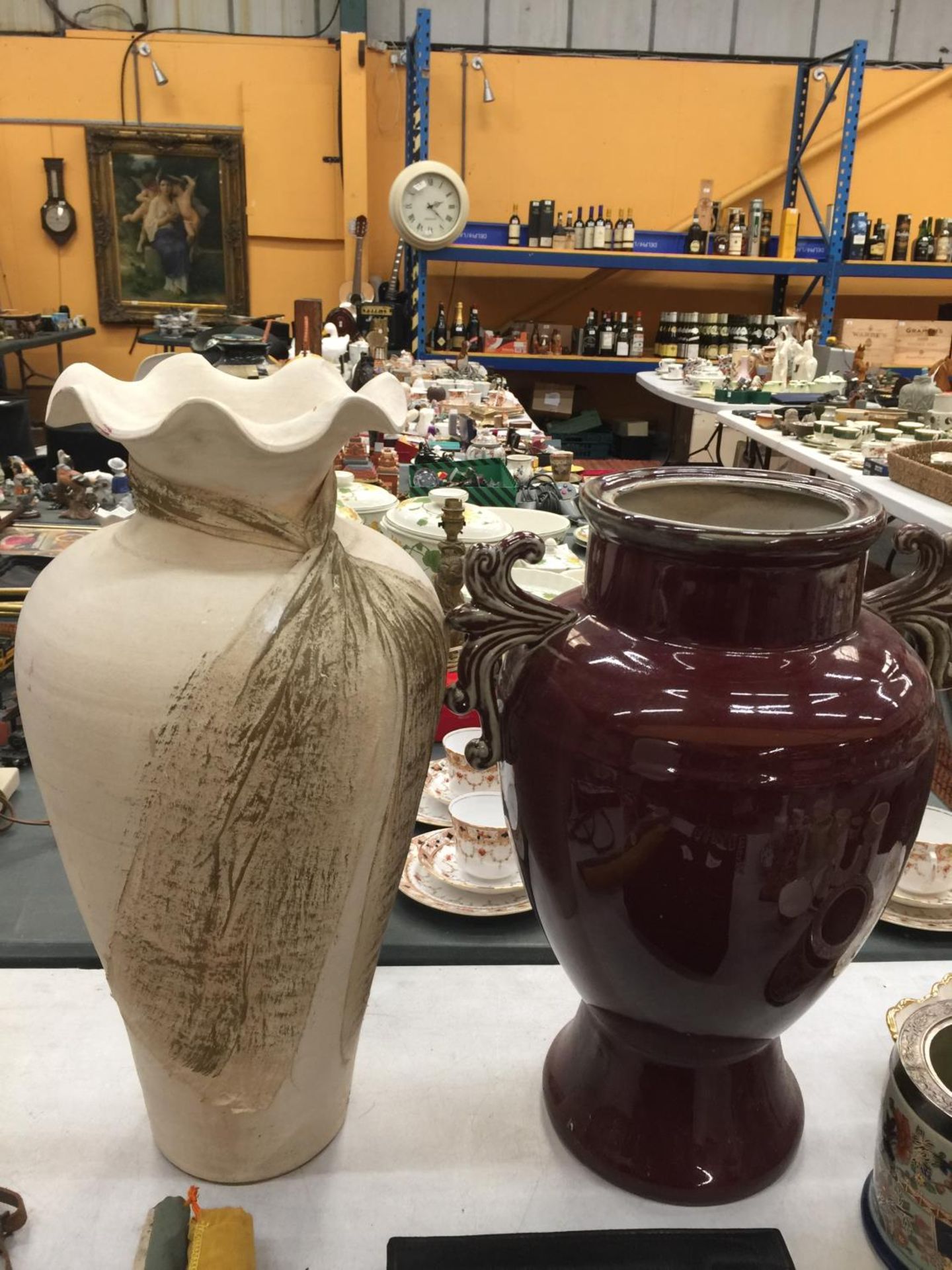 TWO LARGE VASES, ONE STONE EFFECT WITH FLUTED TOP H: 50CM W:30 CM , ONE BURGUNDY GLAZED WITH