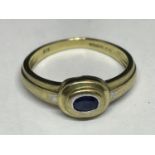 A 9 CARAT GOLD RING WITH A SOLITAIRE SAPPHIRE STONE SIZE K