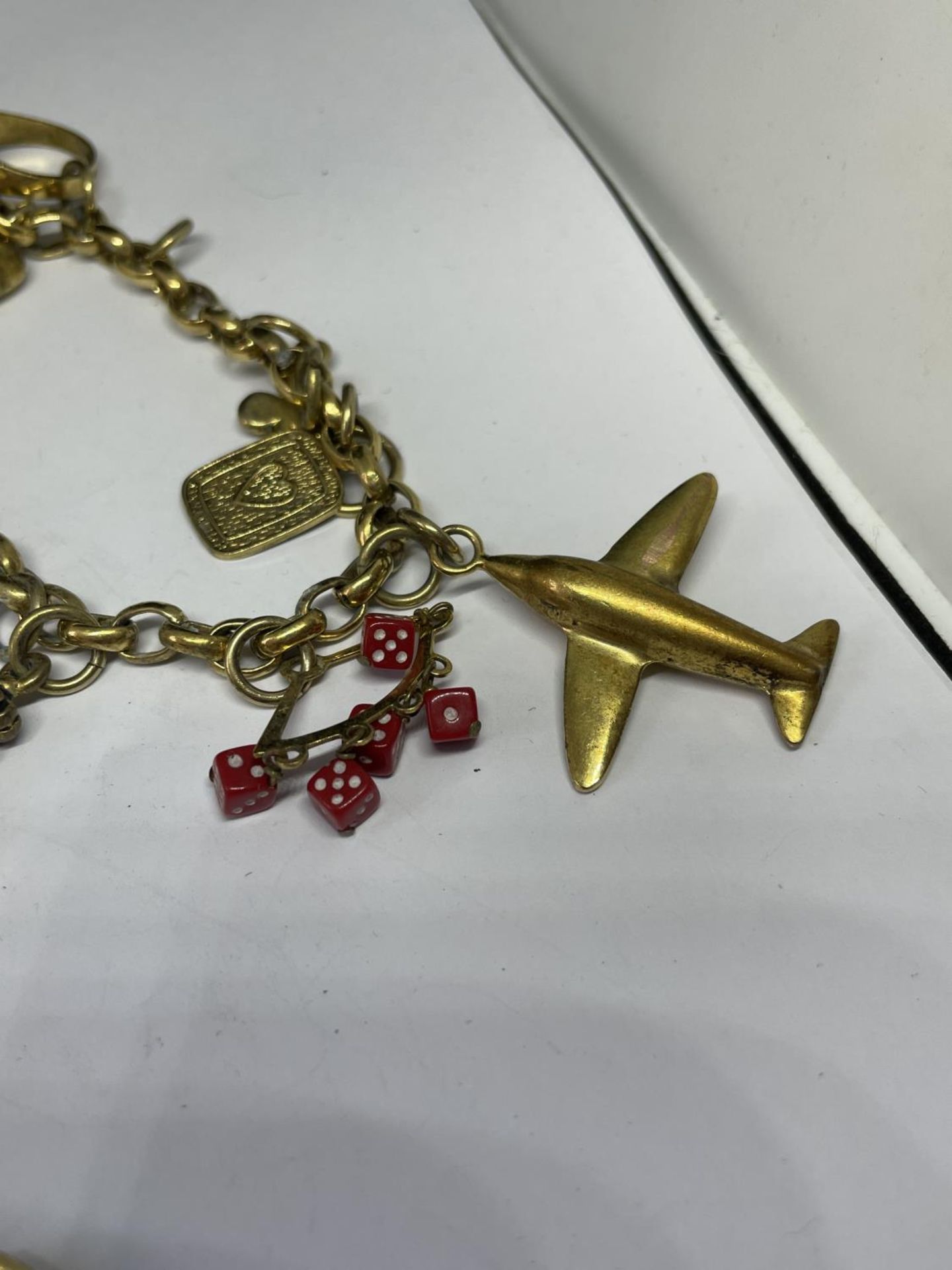 TWO YELLOW METAL BRACELETS TO INCLUDE ONE WITH EIGHT CHARMS - Image 2 of 3