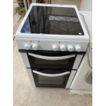 A WHITE AND BLACK LOGIK ELECTRIC OVEN AND HOB