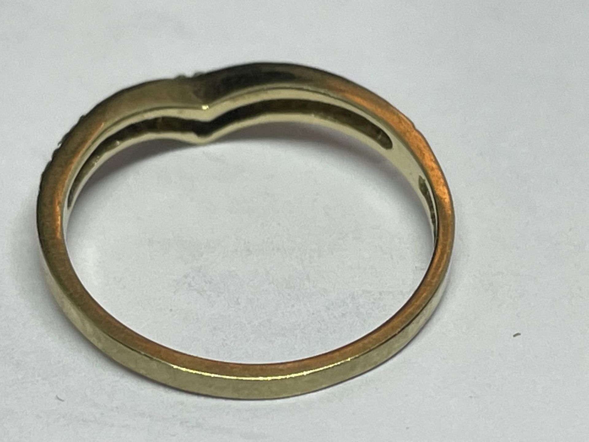 A 9 CARAT GOLD RING WITH DIAMONDS IN A WISHBONE DESIGN SIZE K - Image 3 of 4