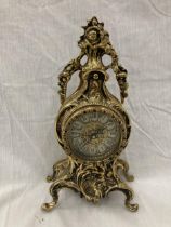A FRENCH ORNATE HEAVY BRASS MANTLE CLOCK WITH BATTERY MOVEMENT