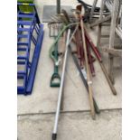 AN ASSORTMENT OF GARDEN TOOLS TO INCLUDE RAKES, FORKS AND SHEARS ETC