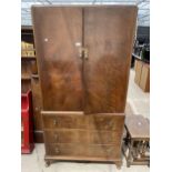 A MID 20TH CENTURY MAHOGANY WARDROBE WITH THREE DRAWERS TO THE BASE, ON CABRIOLE LEGS, 36" WIDE