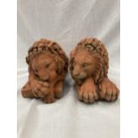 A PAIR OF TERRACOTTA LION STATUES LENGTH 30CM